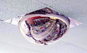 Full dome mirror installed in a 2 by 2 drop ceiling grid opening in an office